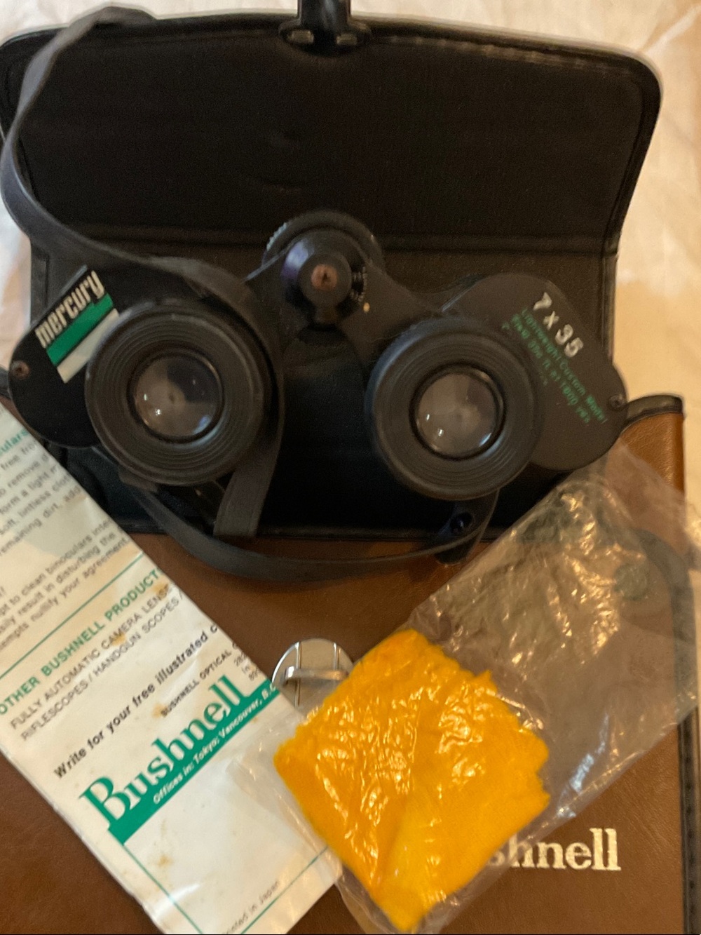 Bushnell Black Binoculars with Brown Case and Neck Strap